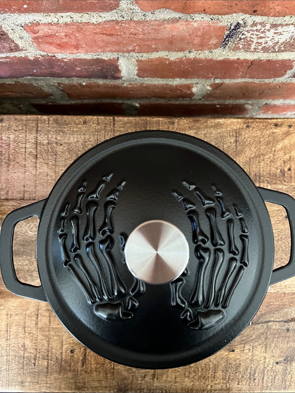 Smith and Clark Black Cast Iron Dutch Oven with Embossed Skeleton Hands Lid